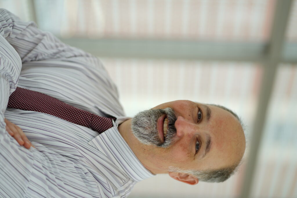 Man in tie with arms crossed